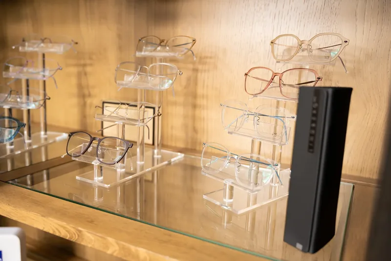 Thin metal ic! berlin frames displayed on risers in the cabinet