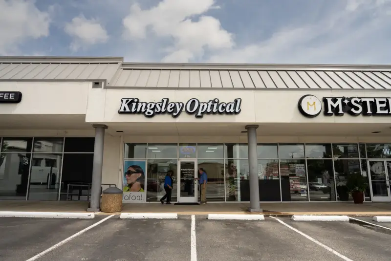 The Kingsley Optical storefront and parking lot at Walnut Hill and Skillman